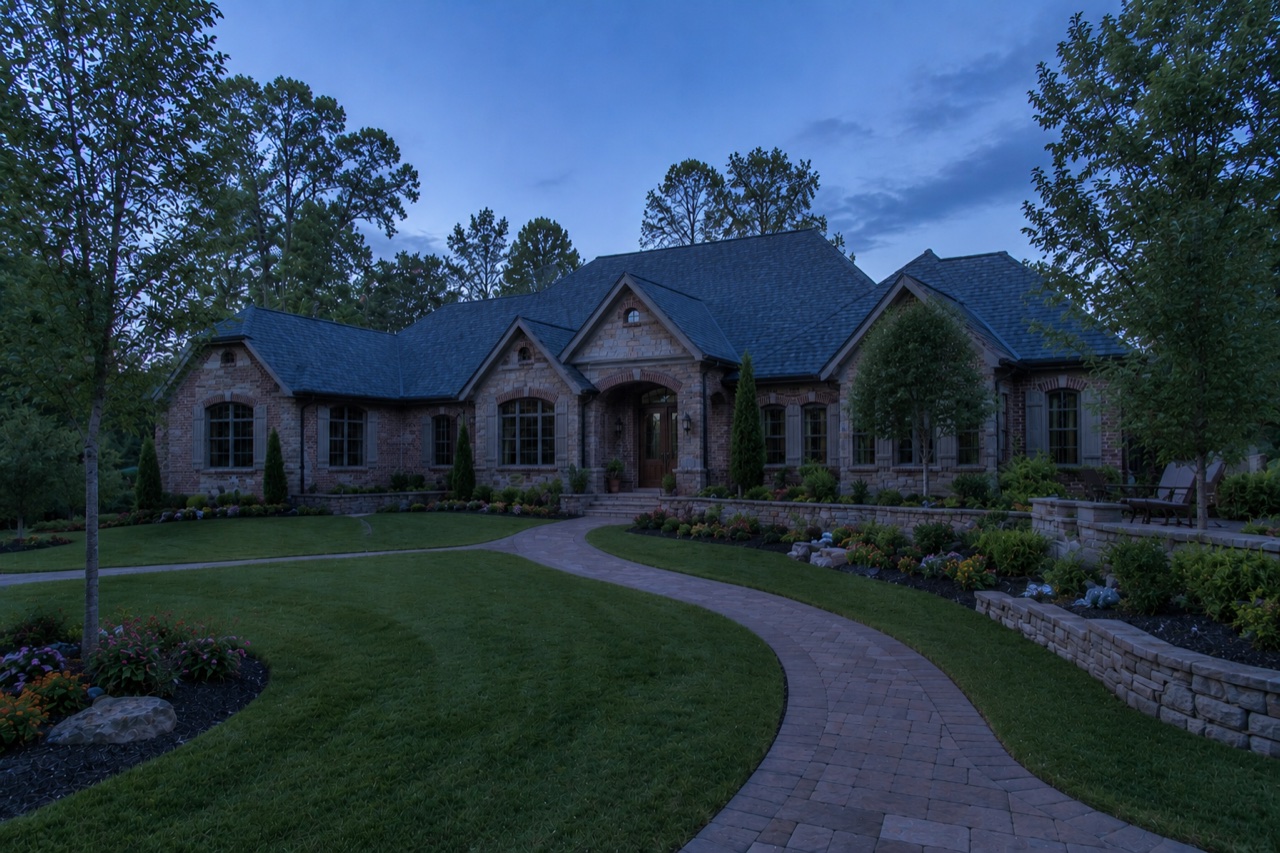 The same Denver, NC home at dusk before outdoor lighting was installed