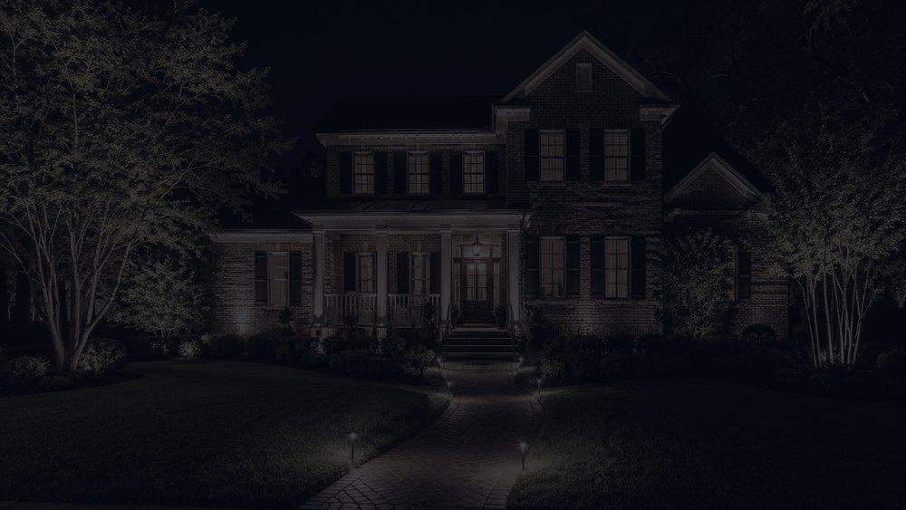 The same Statesville, NC home facade at dusk before outdoor lighting was installed