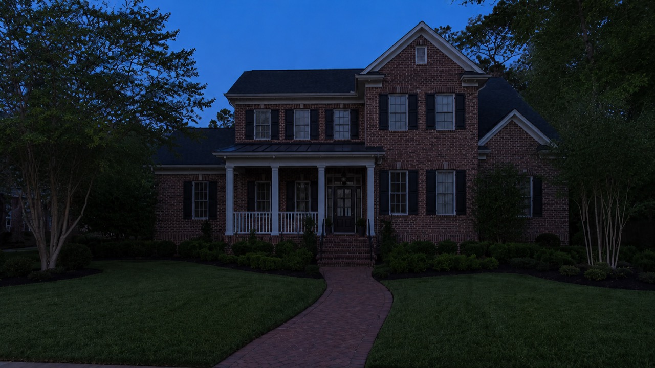 The same Troutman, NC home at dusk before outdoor lighting was installed